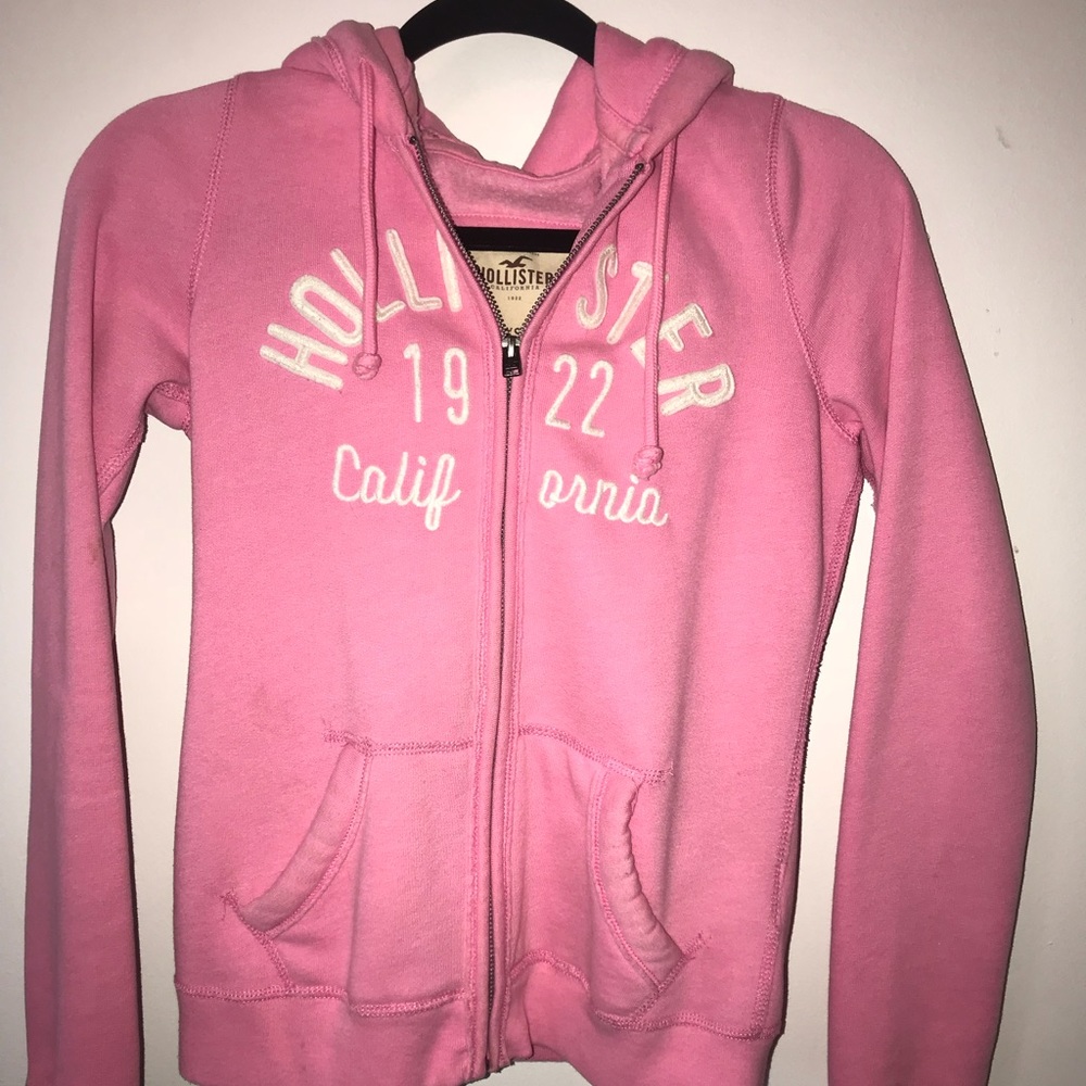 A pink zip up hoodie